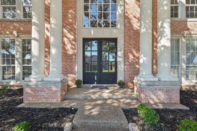 property entrance featuring french doors