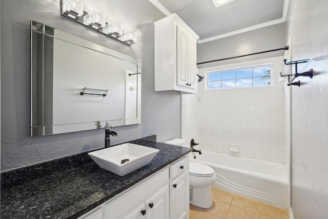 full bathroom with tile patterned floors, toilet, vanity, and tiled shower / bath