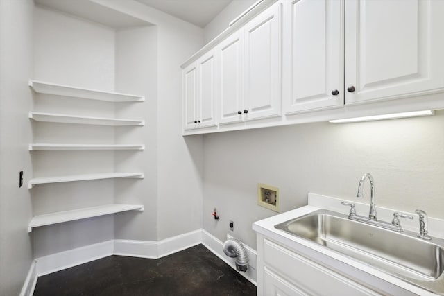 clothes washing area with cabinets, washer hookup, electric dryer hookup, sink, and hookup for a gas dryer