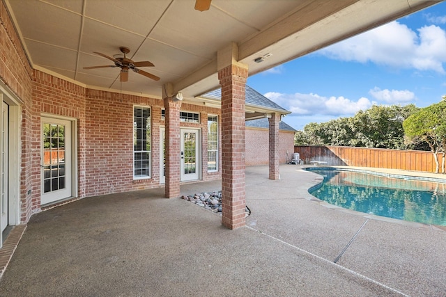 view of swimming pool featuring a patio and ceiling fan