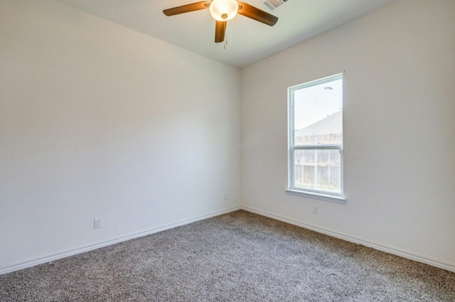 empty room featuring carpet flooring and ceiling fan