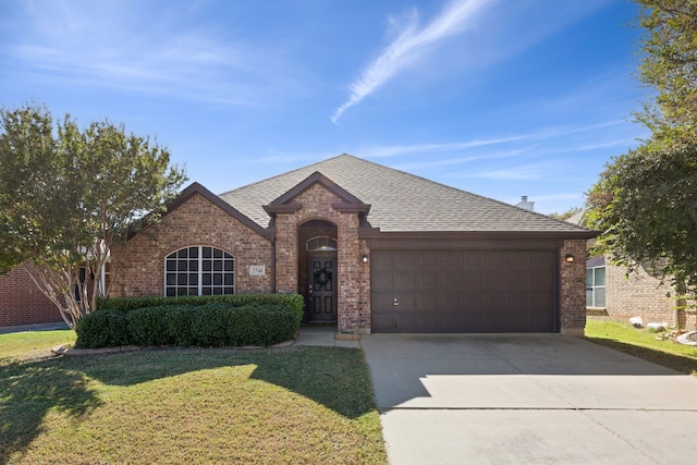 ranch-style house with a front lawn and a garage