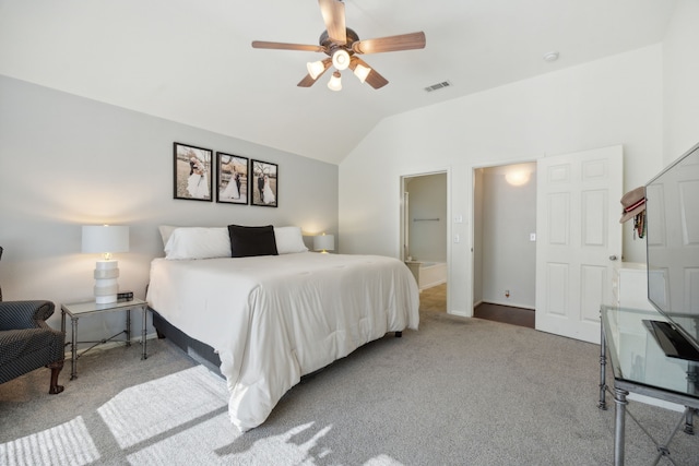 carpeted bedroom with vaulted ceiling and ceiling fan