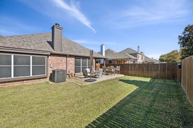 view of yard with a patio area and central AC unit