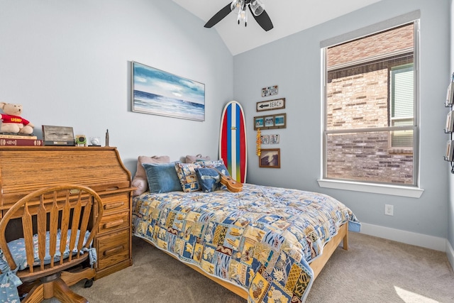 carpeted bedroom featuring lofted ceiling and ceiling fan