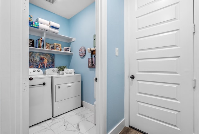 clothes washing area featuring washing machine and dryer