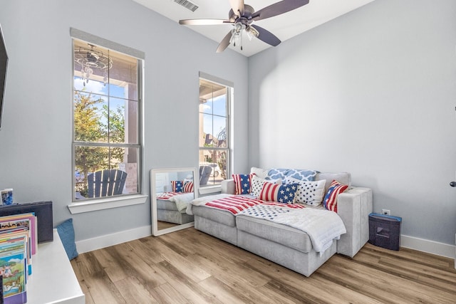 bedroom with wood-type flooring and ceiling fan