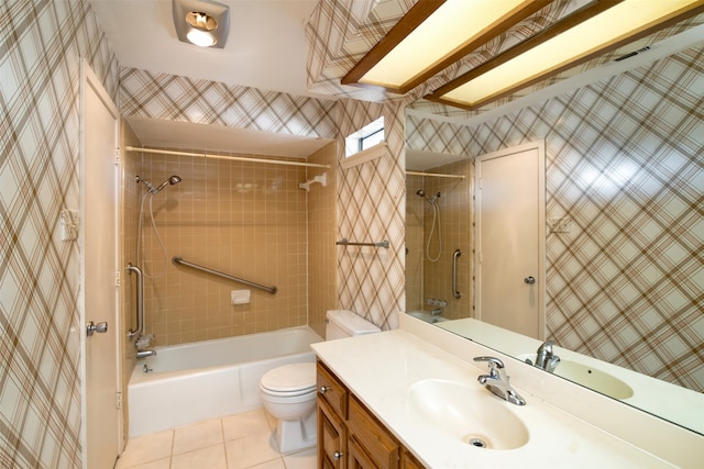 full bathroom featuring vanity, toilet, tile patterned flooring, and tiled shower / bath