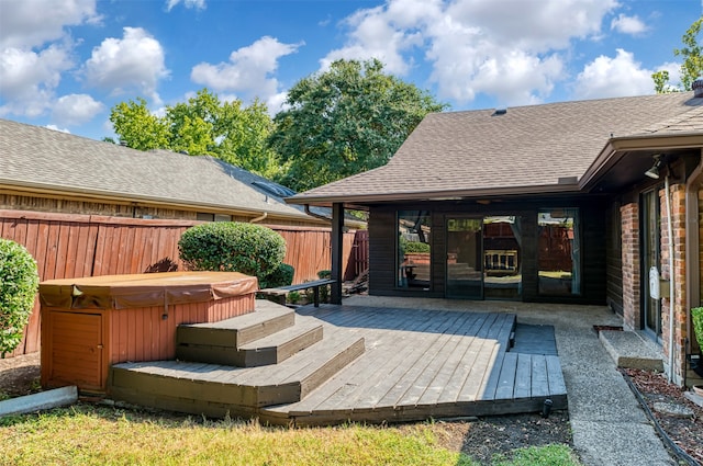 deck featuring a hot tub