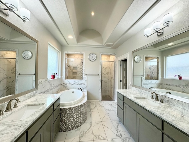 bathroom with vanity, plus walk in shower, and a textured ceiling