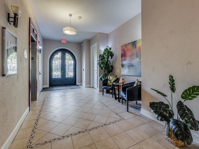 tiled entryway with french doors