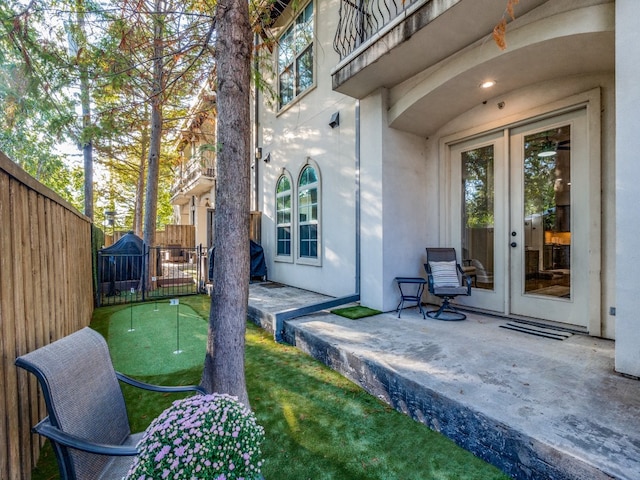 doorway to property featuring a patio area