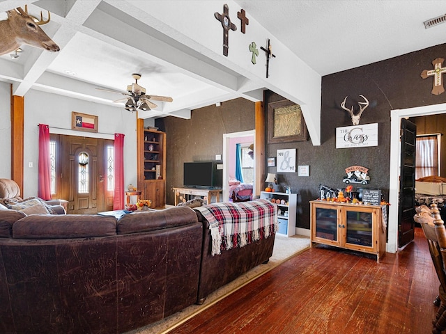 living room with coffered ceiling, ceiling fan, dark wood-type flooring, and beamed ceiling