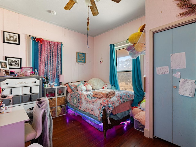 bedroom featuring dark hardwood / wood-style floors and ceiling fan