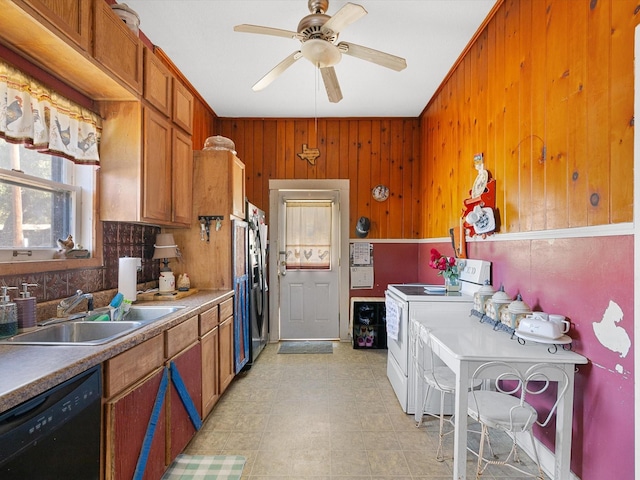 kitchen with sink, ceiling fan, electric range, wooden walls, and black dishwasher