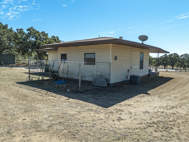 back of property with central AC unit