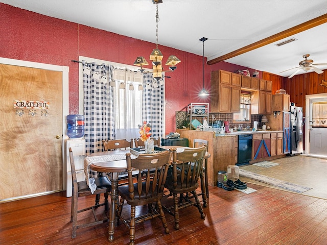 dining room featuring beamed ceiling, ceiling fan, and dark hardwood / wood-style flooring