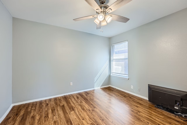 unfurnished room with hardwood / wood-style floors and ceiling fan