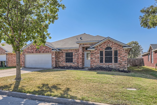 ranch-style house featuring a front lawn and a garage