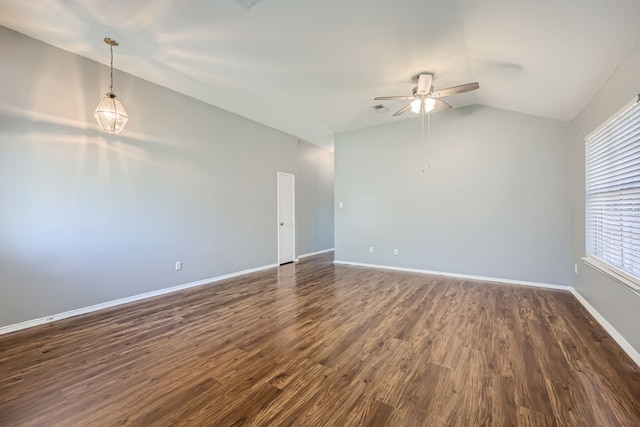 unfurnished room featuring ceiling fan, lofted ceiling, and dark hardwood / wood-style flooring