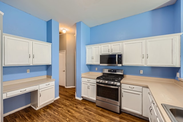 kitchen featuring white cabinets, stainless steel appliances, sink, and dark hardwood / wood-style flooring