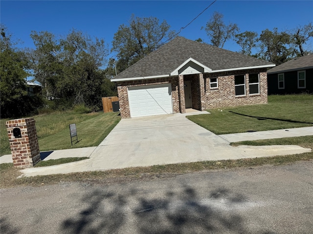 view of front of house featuring a front yard and a garage