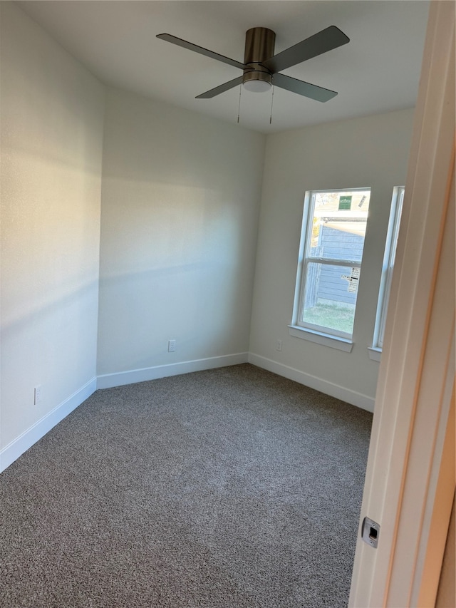 unfurnished room featuring carpet flooring and ceiling fan