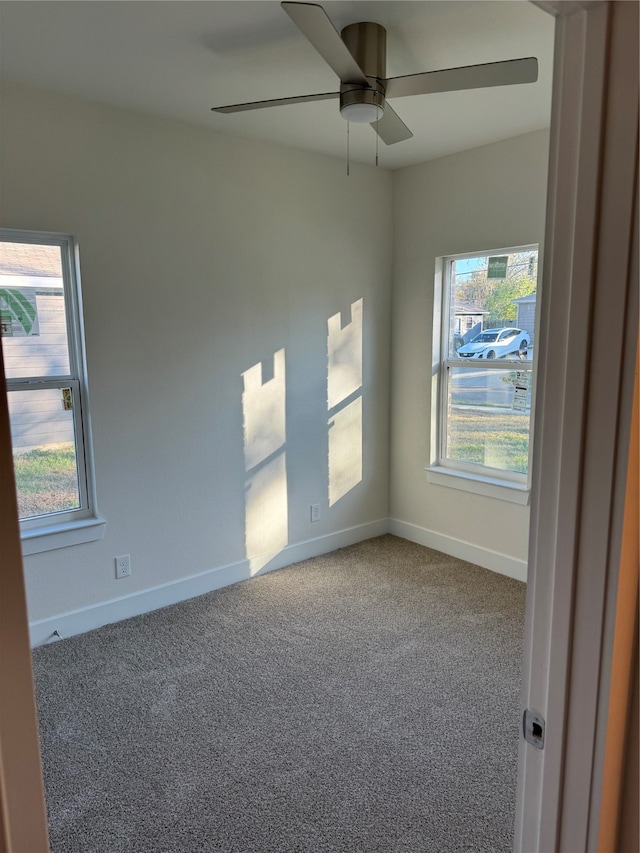 spare room with carpet flooring and ceiling fan