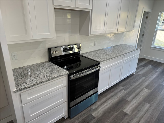 kitchen featuring decorative backsplash, white cabinets, dark hardwood / wood-style flooring, stainless steel electric range oven, and light stone counters