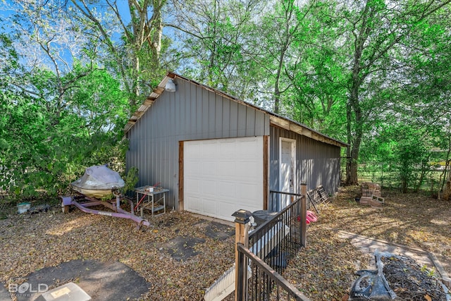 garage featuring wood walls