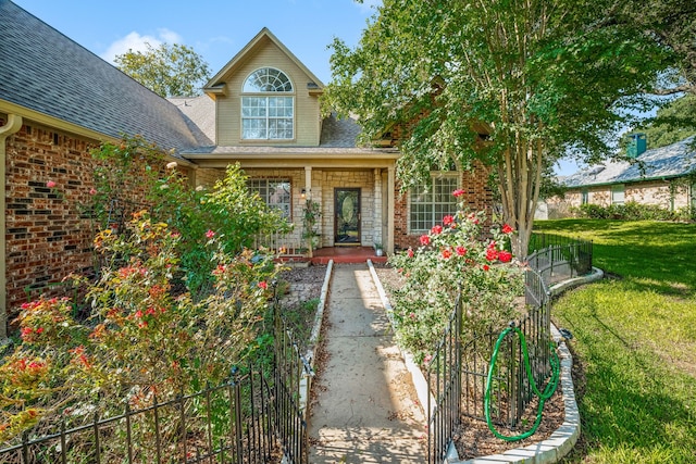 doorway to property with a yard