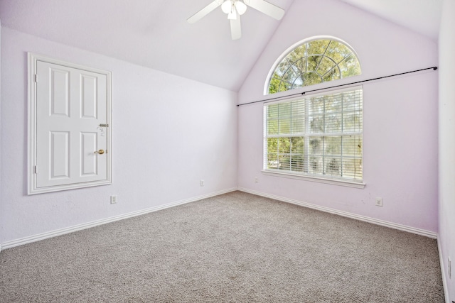 spare room with lofted ceiling, ceiling fan, and carpet floors