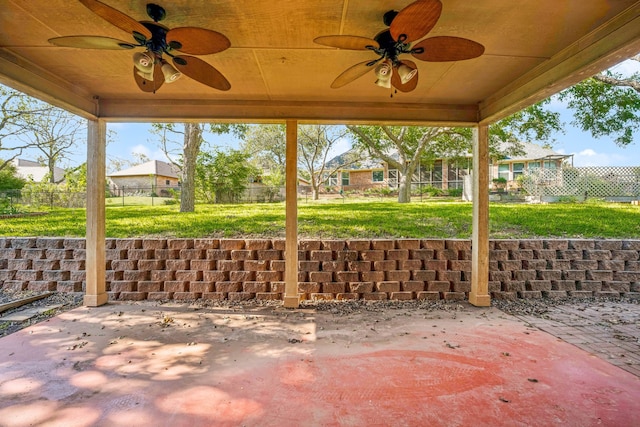 view of patio featuring a ceiling fan and fence