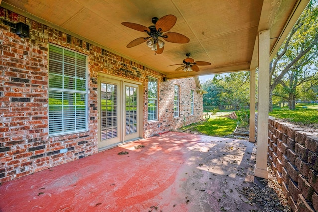 view of patio with fence and a ceiling fan