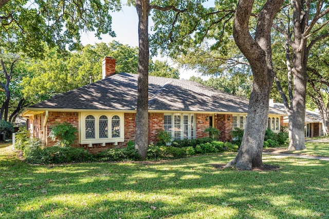 ranch-style house with a front lawn