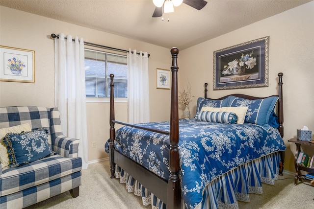 bedroom with carpet flooring, ceiling fan, and a textured ceiling