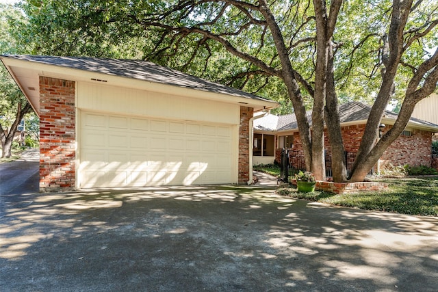 ranch-style house featuring a garage