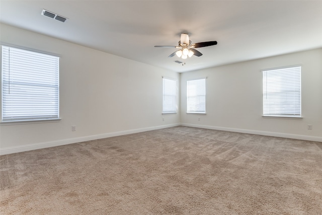 empty room with light carpet and ceiling fan