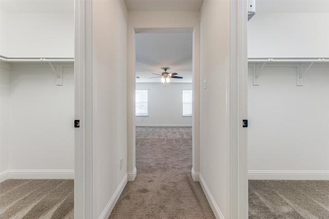 hallway featuring light carpet