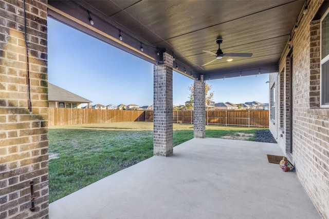 view of patio featuring ceiling fan