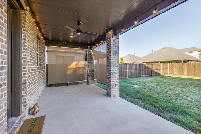 view of patio featuring ceiling fan