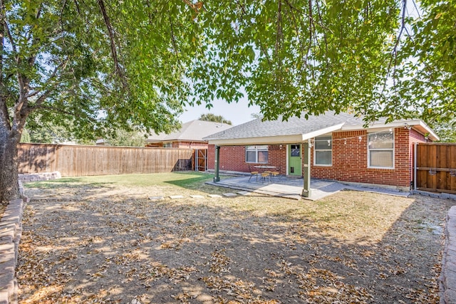 rear view of house featuring a patio area