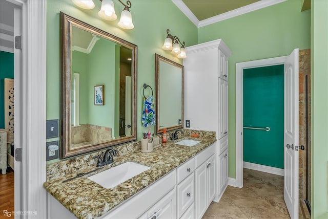 bathroom with vanity and ornamental molding