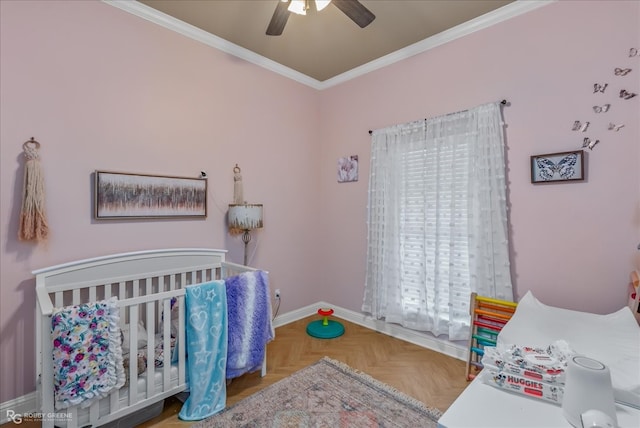 bedroom featuring parquet flooring, crown molding, a nursery area, and ceiling fan