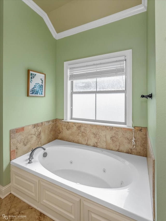 bathroom featuring crown molding, tile patterned flooring, and a bathing tub