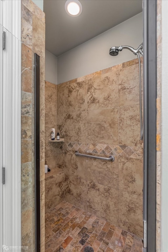 bathroom with a tile shower