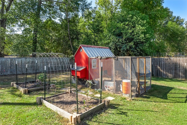 view of outbuilding with a lawn