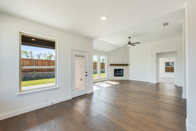 unfurnished living room featuring lofted ceiling, ceiling fan, a large fireplace, and dark hardwood / wood-style flooring