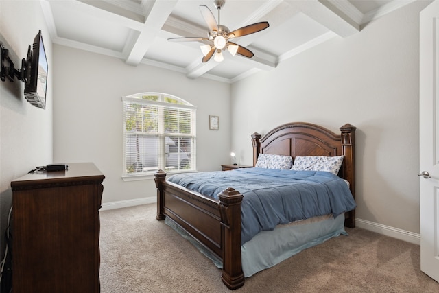 carpeted bedroom with crown molding, beam ceiling, and ceiling fan