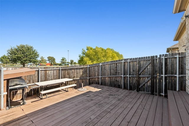 deck featuring a grill